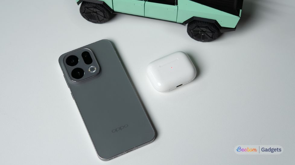 Oppo smartphone with AirPods case beside it Oppo smartphone with AirPods case beside it