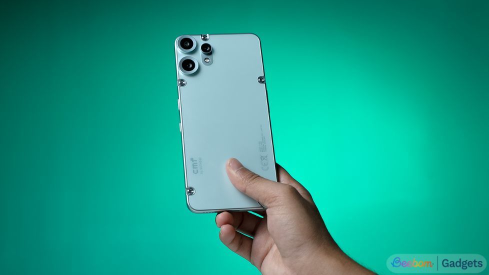 Person holding a CMF Phone 2 Pro from the back