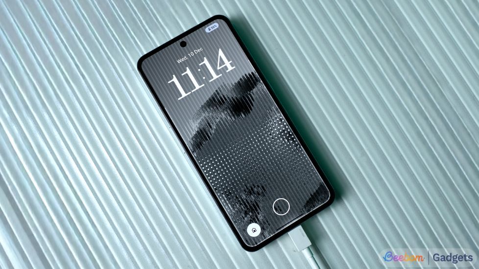 CMF Phone 2 Pro lying flat on the table connected to the charger