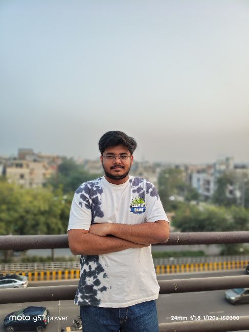 Moto G57 power main camera image of person in white shirt