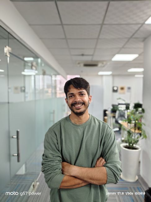 Moto G57 power main camera image of person in olive shirt