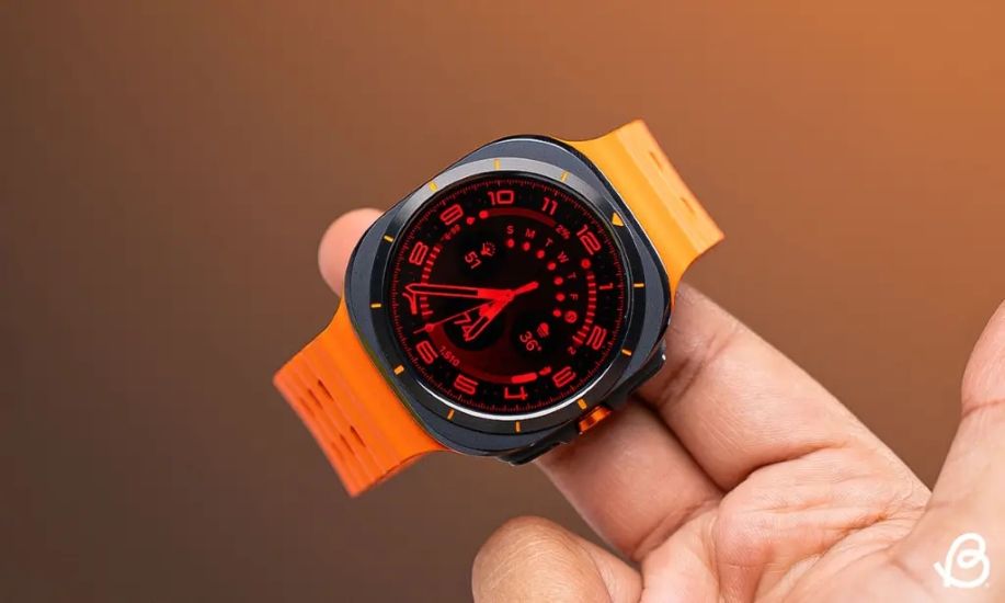 Samsung Galaxy Watch Ultra in hand in orange colourway