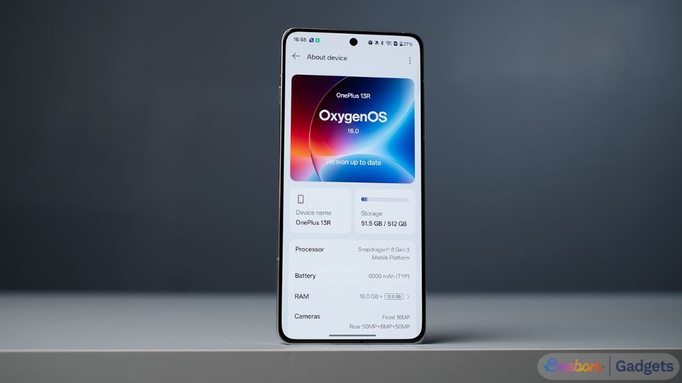 OnePlus 13R standing upright with its About Phone page