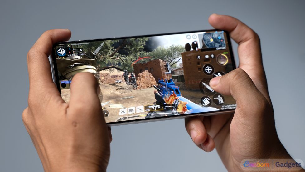 OnePlus 13R in hand with Call of Duty running