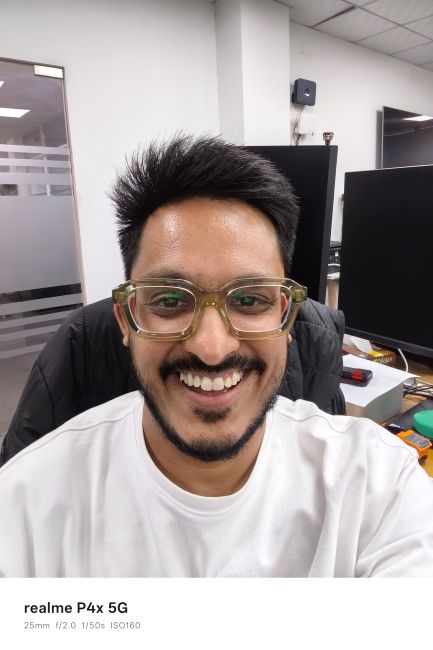 Realme P4x selfie photo of a person wearing a white shirt Realme P4x selfie photo of a person wearing a white shirt