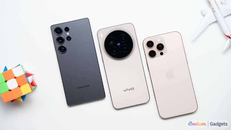 Samsung, Vivo and iPhone laying flat on the table slightly tilted