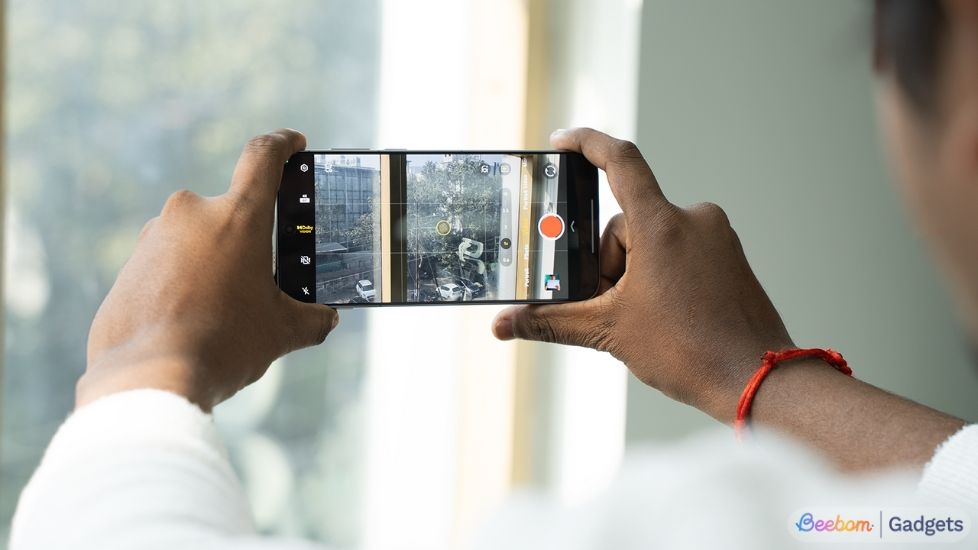 Person shooting with a Vivo X series smartphone