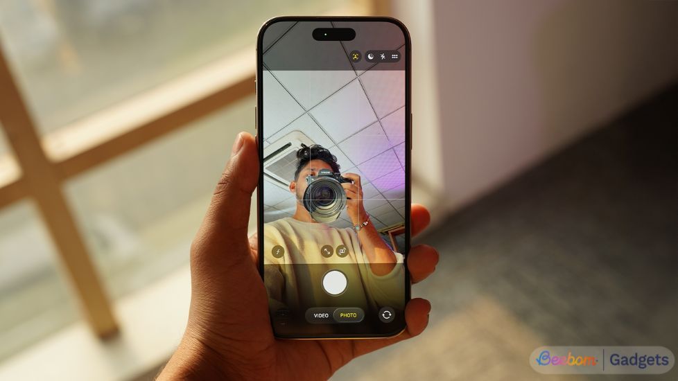 iPhone 17 front camera active with a person holding a camera