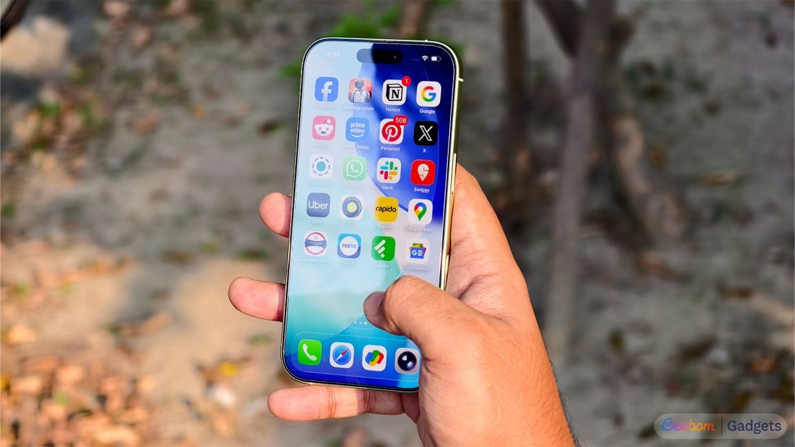 shot of a hand holding an iPhone 17 showing the display