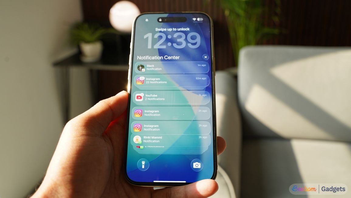 iPhone Liquid Glass design on lock screen with notifications