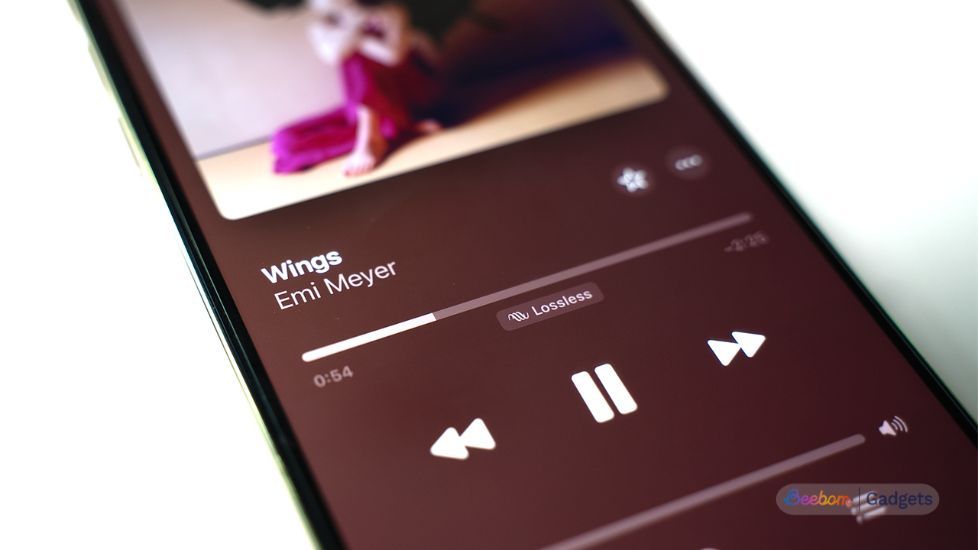Apple Lossless audio tag on a smartphone screen below the miniplayer Apple Lossless audio tag on a smartphone screen below the miniplayer