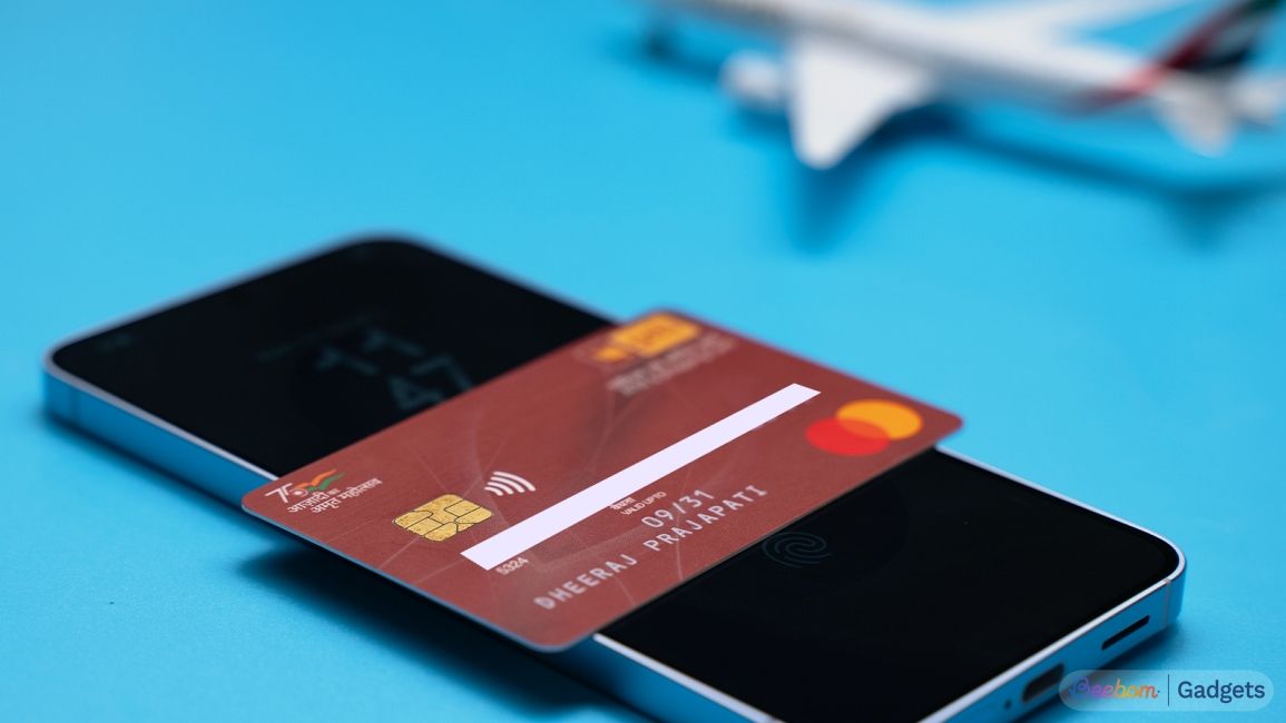 Galaxy smartphone with a PNB card on top against a blue background