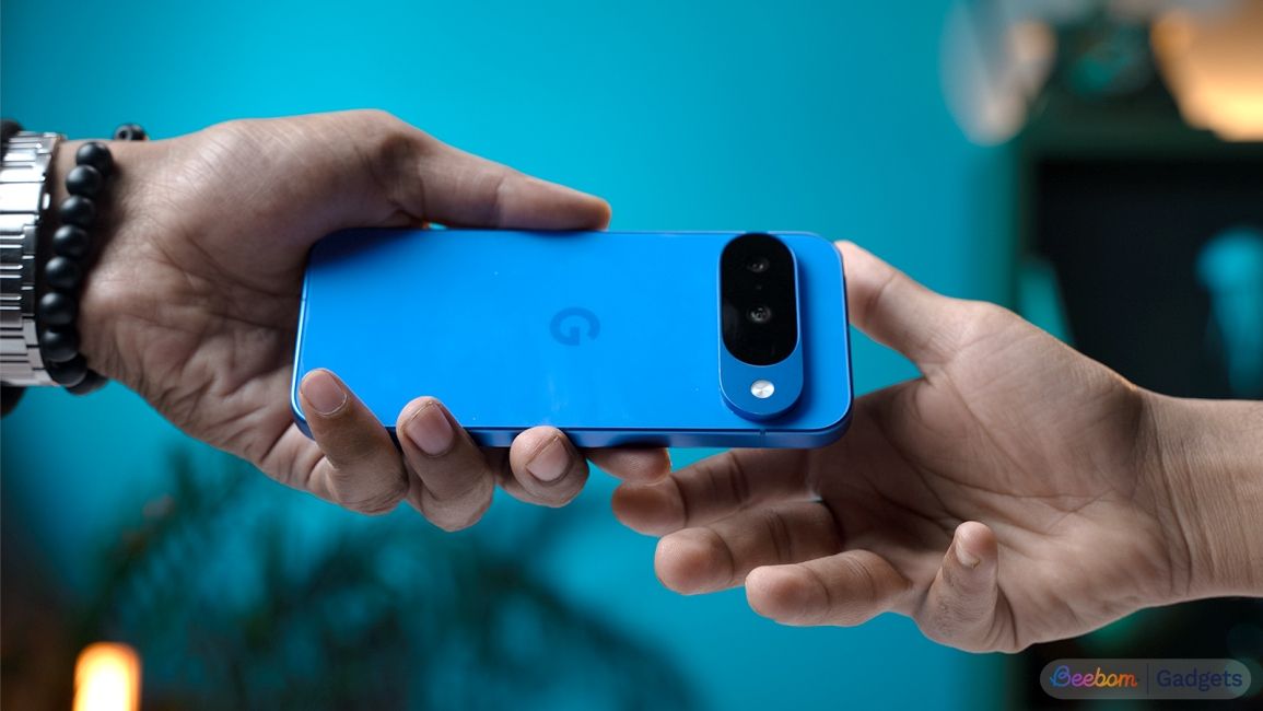 Person handing a Pixel 10 to another person