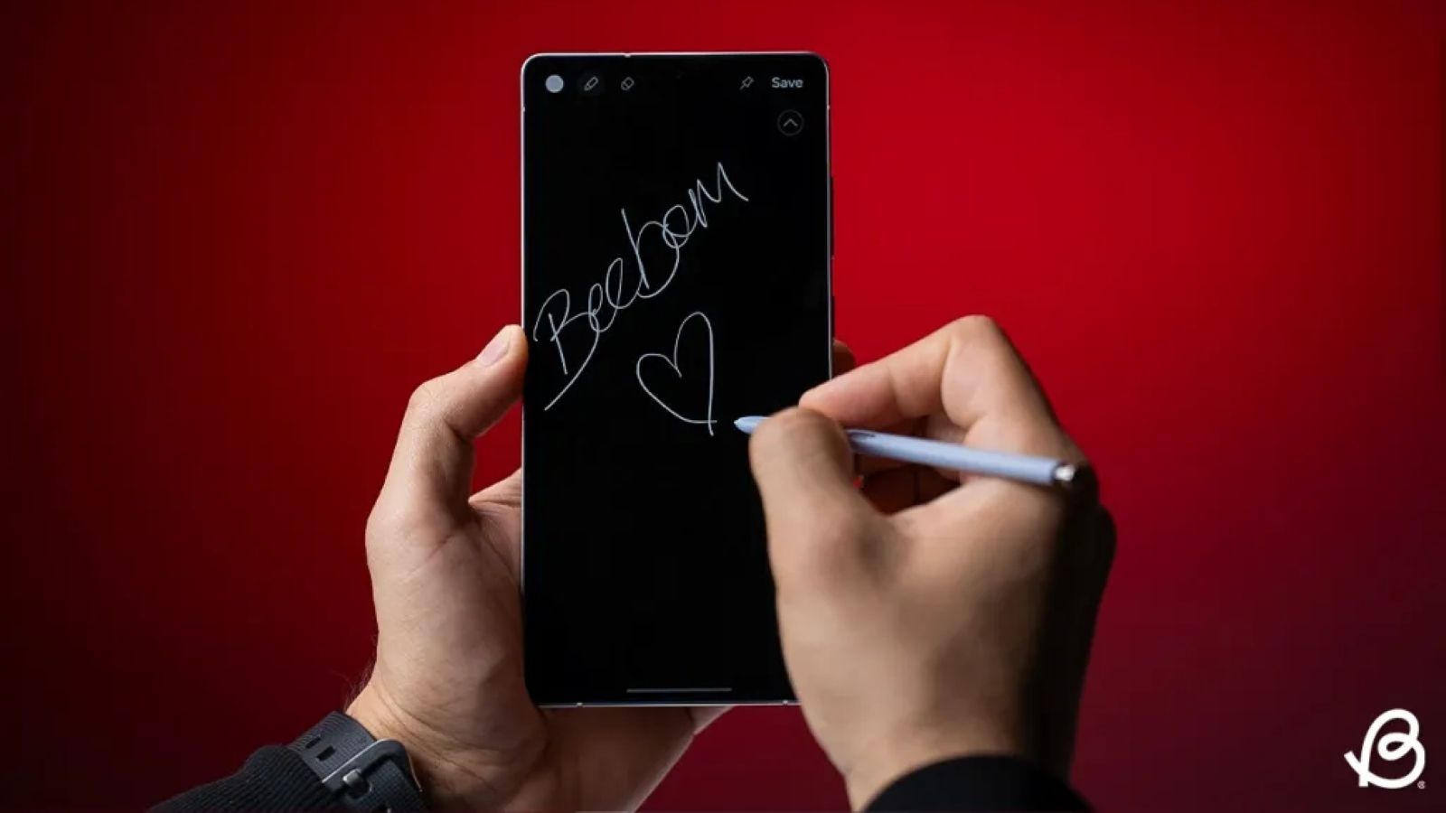 Person writing on Galaxy s25 display with S-Pen