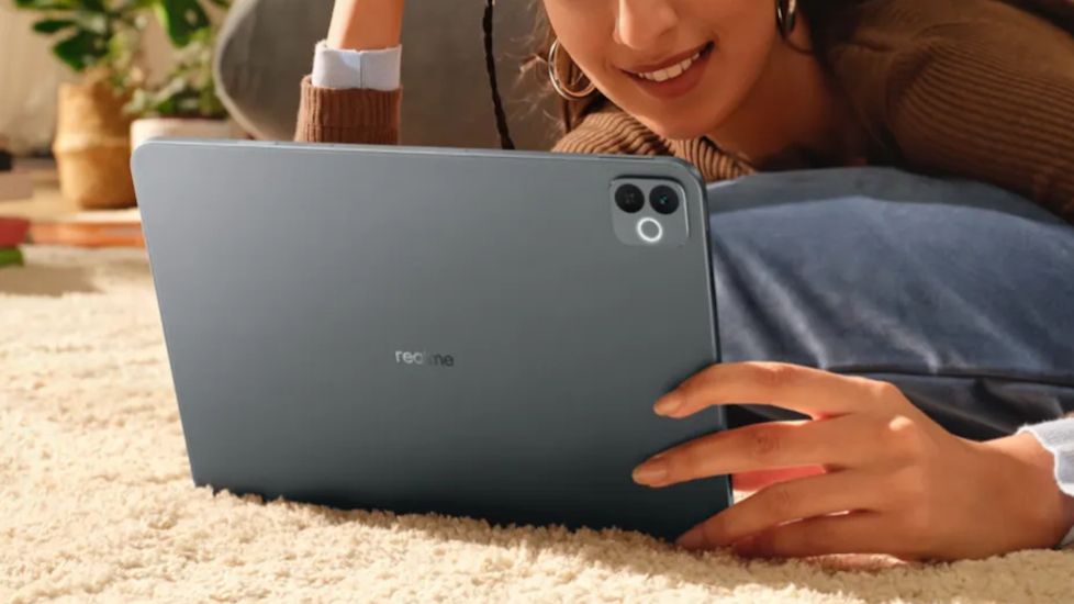 Realme Pad 3 grey in hand design showcased Realme Pad 3 grey in hand design showcased