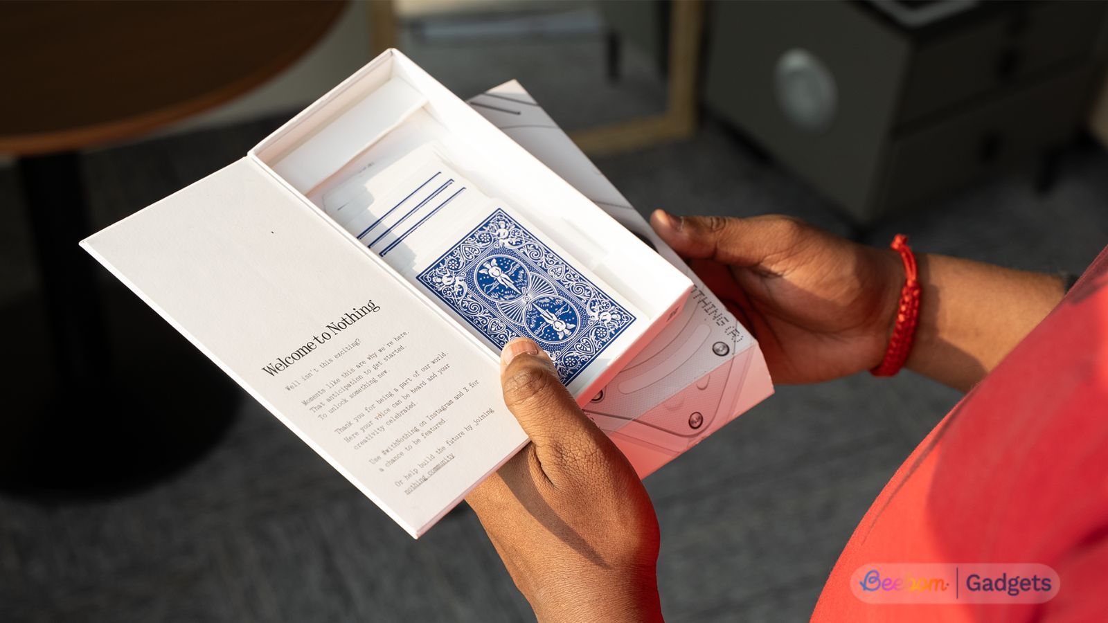 Nothing Phone box open with a pack of cards inside