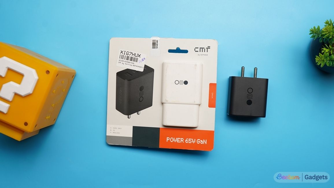 CMF 65 GaN charger top down shot on a blue background