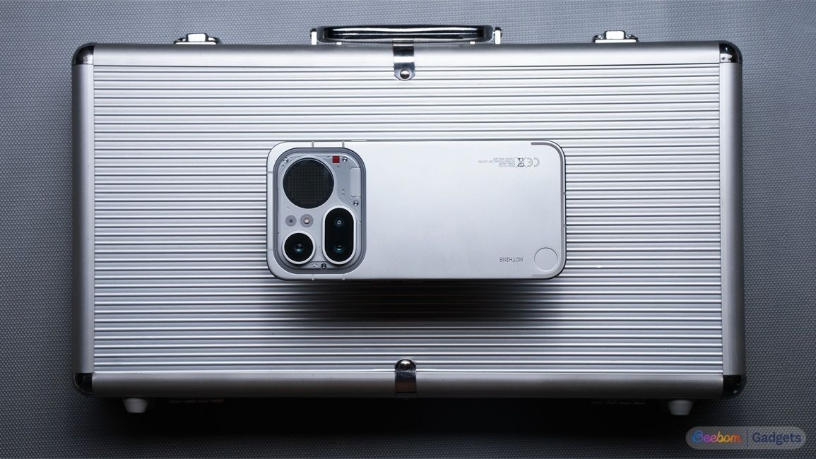 Nothing Phone (4a) Pro laying down on a suitcase