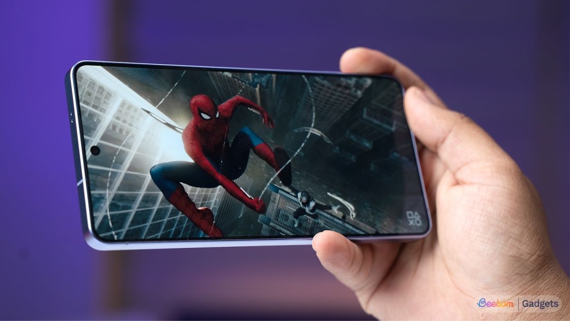 Samsung Galaxy S26 Ultra showing spiderman on the display against a purple background