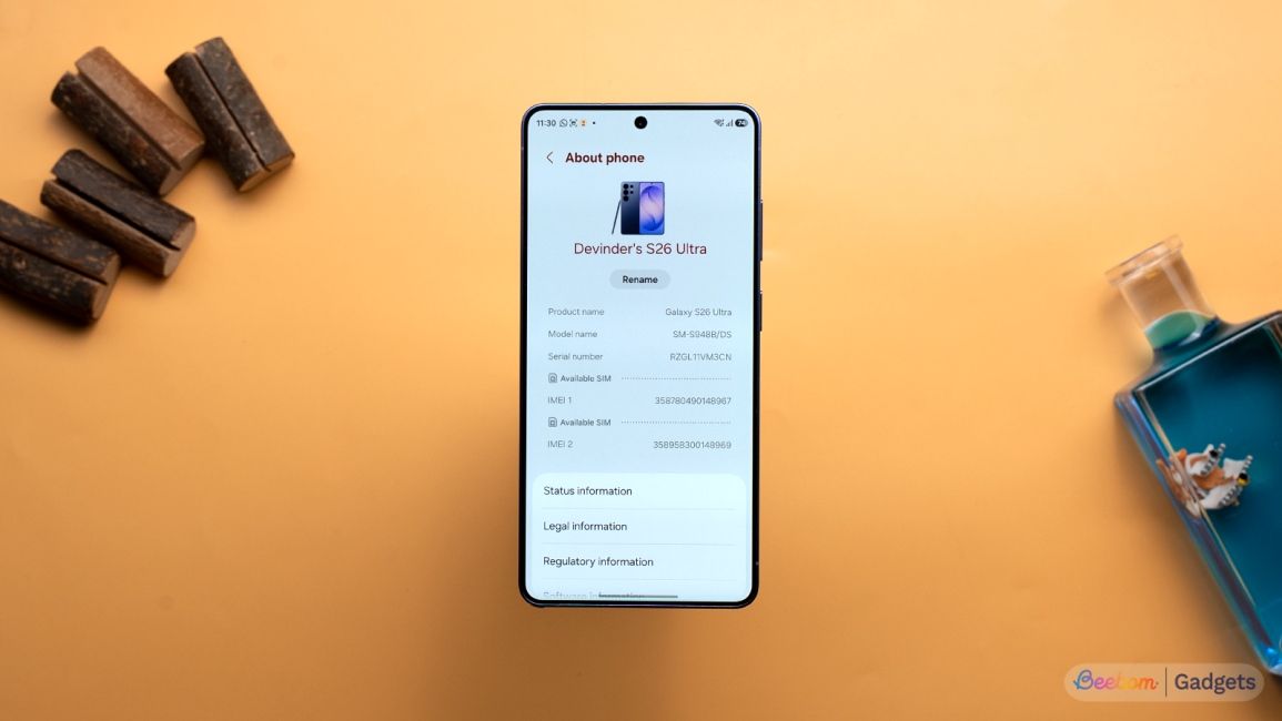 Samsung Galaxy S26 Ultra software about page shown on the screen against an orange background
