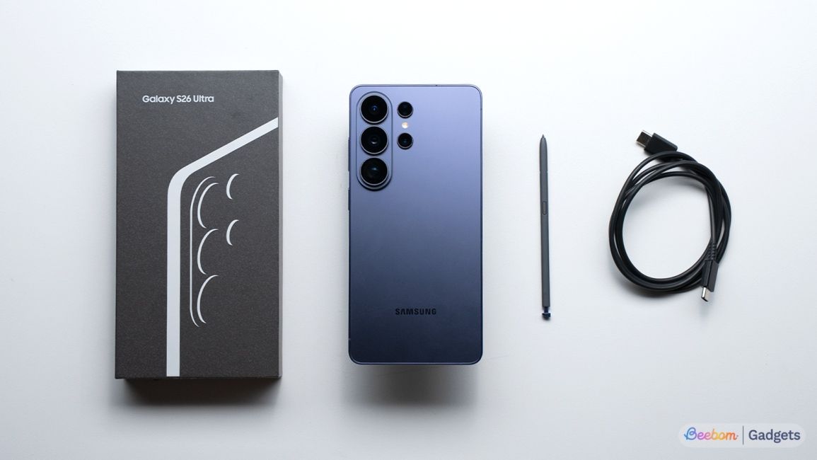 Samsung Galaxy S26 Ultra with its box contents on a white table