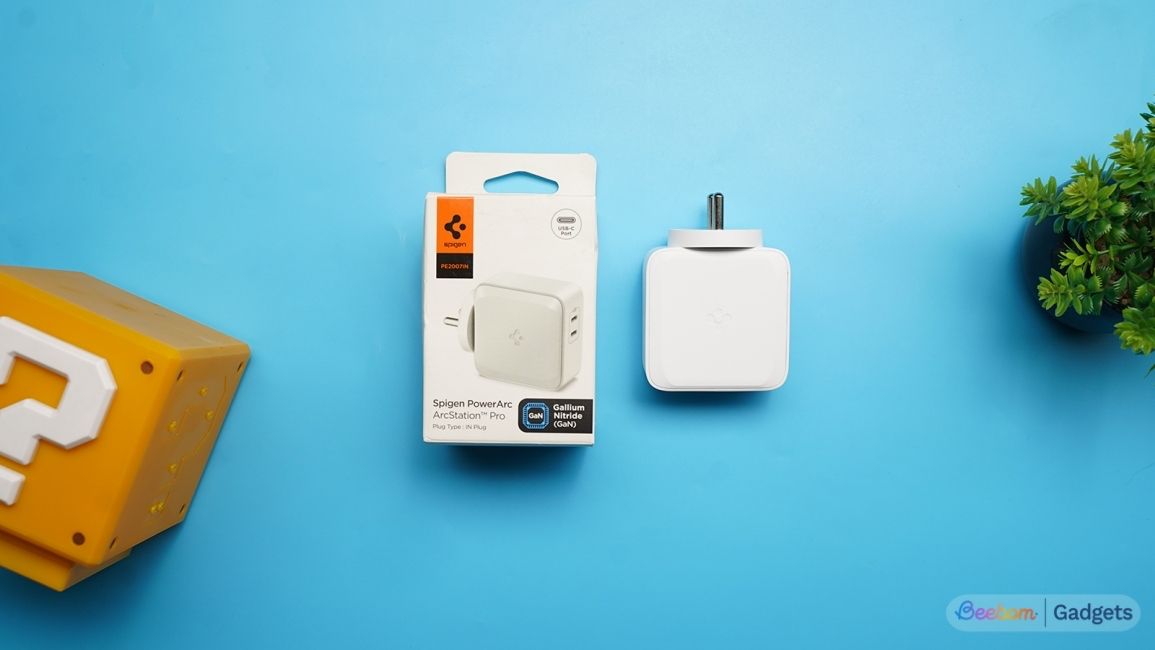 Spigen PowerArc GaN fast charger top down shot on a blue background