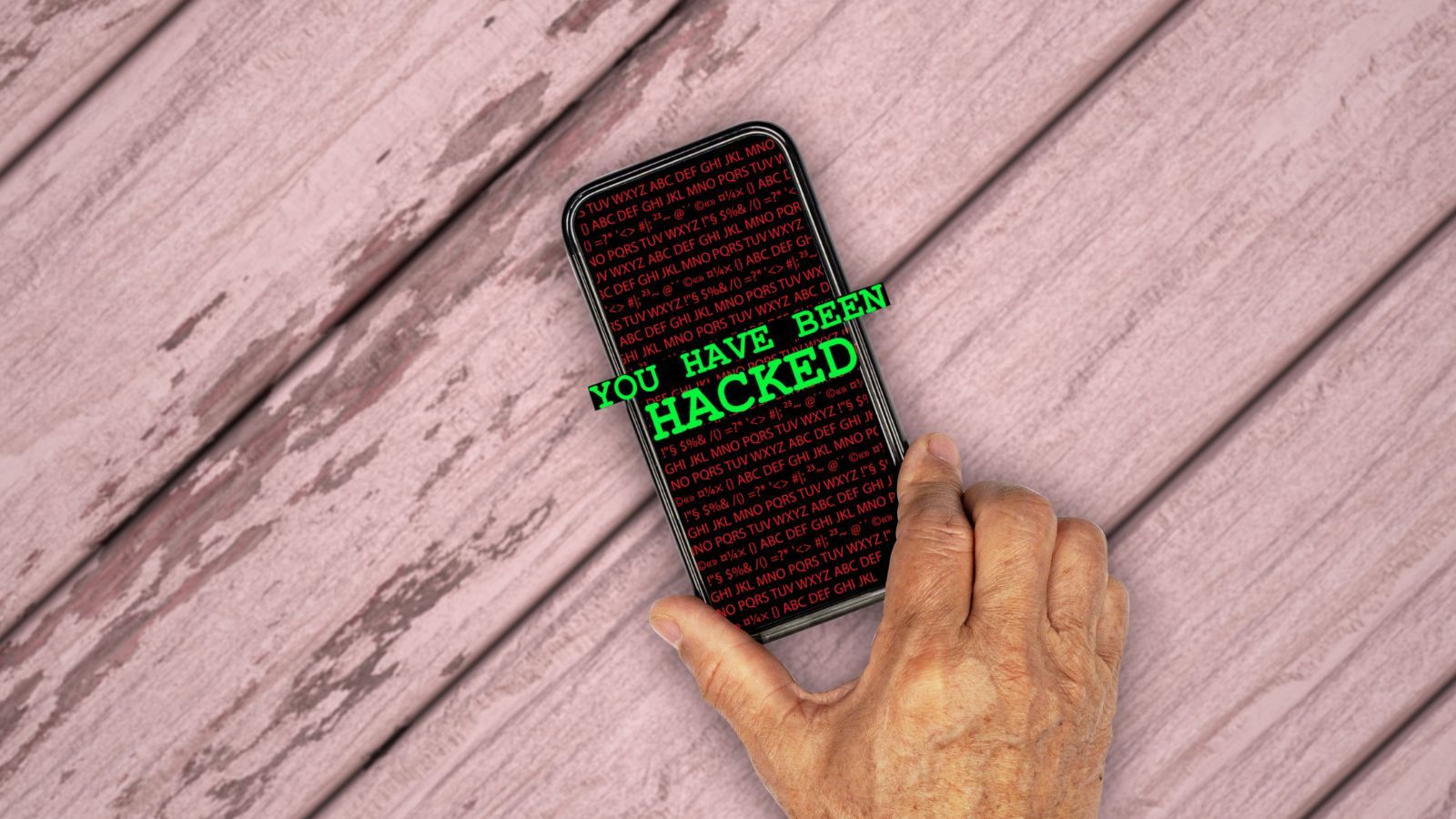Image of an iPhone with "You Have Been Hacked" message displayed Image of an iPhone with "You Have Been Hacked" message displayed