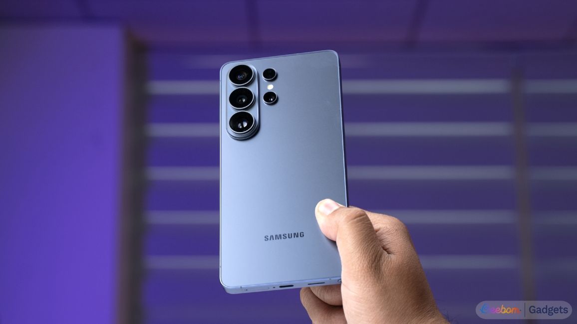shot of a hand holding the Samsung Galaxy S26 Ultra showing the rear design in front of a purple background