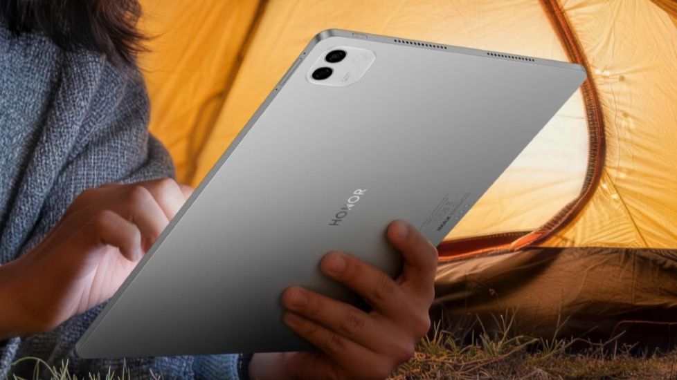 Honor MagicPad 3 Pro in silver held in hand from the back