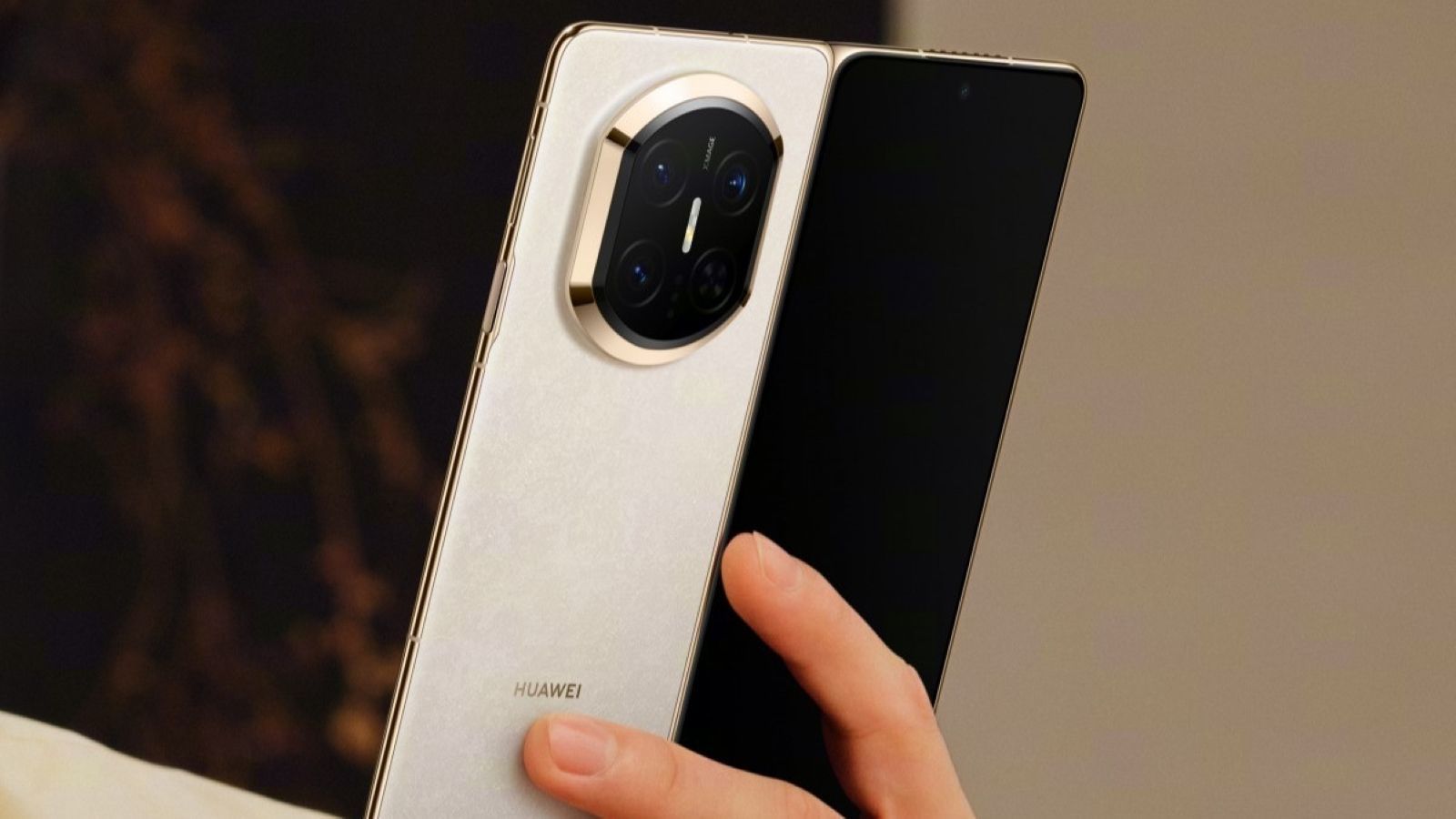 Huawei Mate X7 held in hand in white colourway