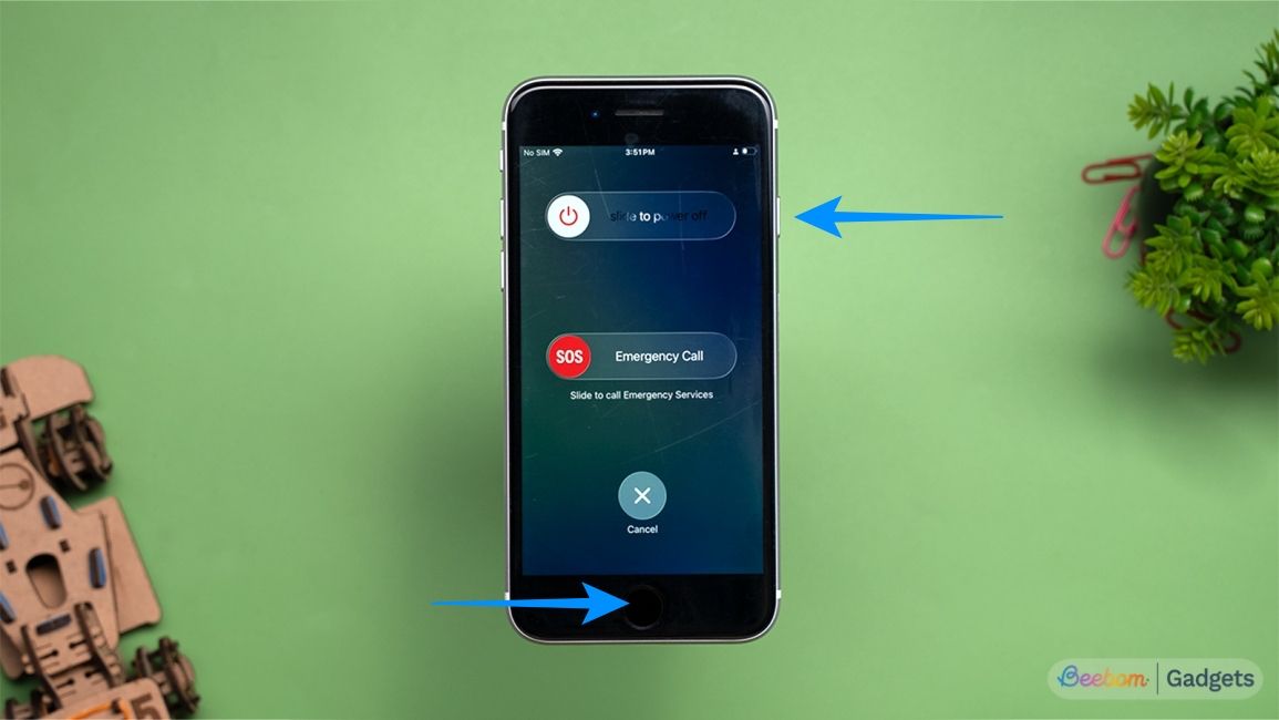 Press power and home button on older iPhones