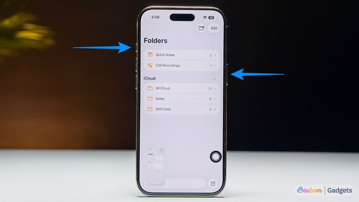 Shot of an iPhone Air with arrows pointing at power and volume buttons