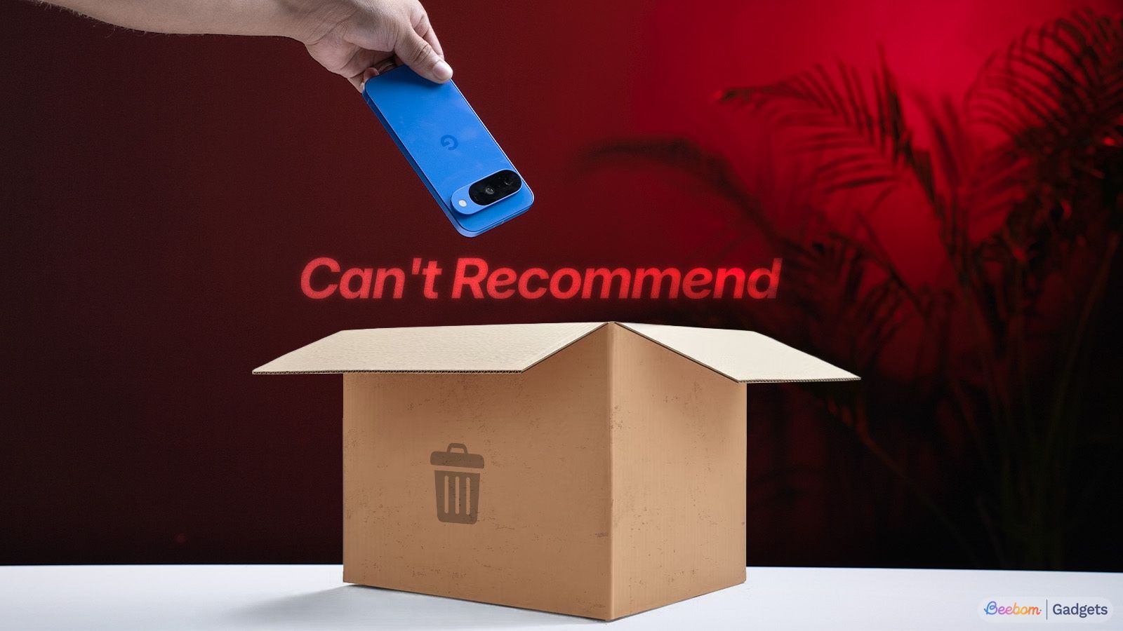 shot of a hand throwing the Pixel 10 onto a rectangular box