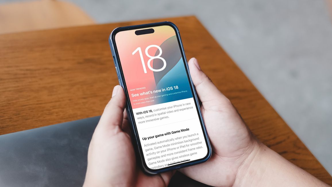iOS 18 update page open on an iPhone which is in hand iOS 18 update page open on an iPhone which is in hand
