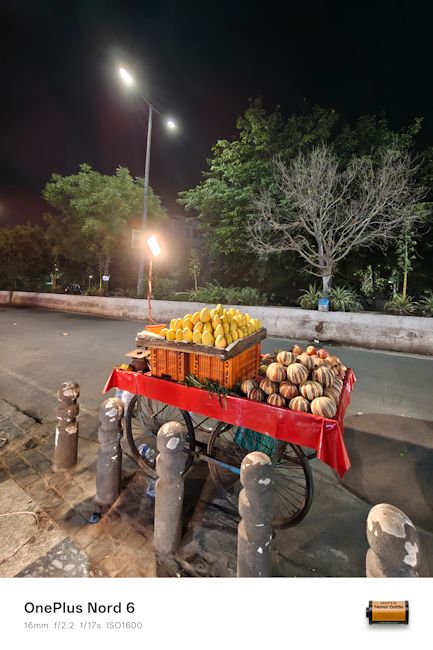OnePlus Nord 6 16mm fruit stall night shot OnePlus Nord 6 16mm fruit stall night shot