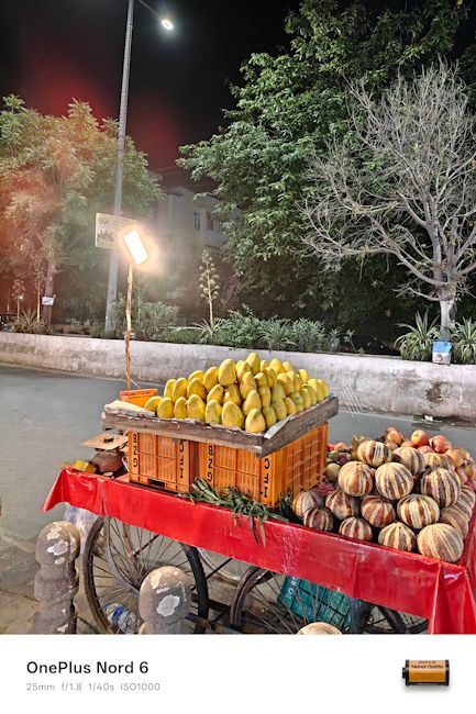 OnePlus Nord 6 25mm fruit stall night shot OnePlus Nord 6 25mm fruit stall night shot