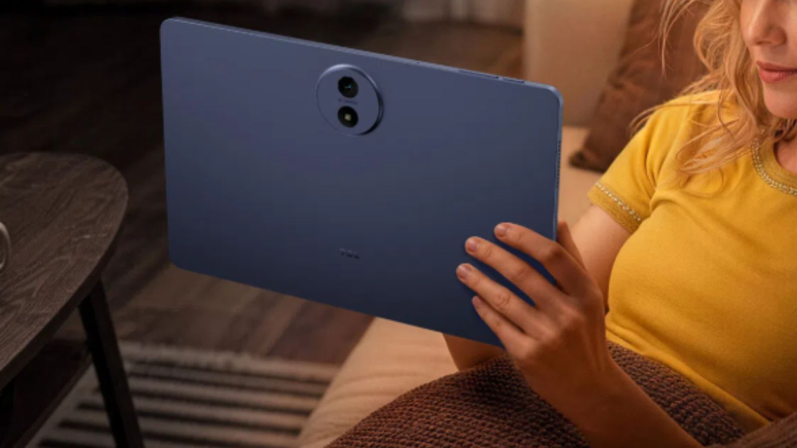 TCL Tab A1 Plus Space Blue back design showcased while in hand TCL Tab A1 Plus Space Blue back design showcased while in hand