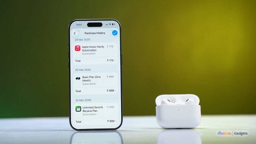 Apple iPhone beside AirPods with recent app purchases