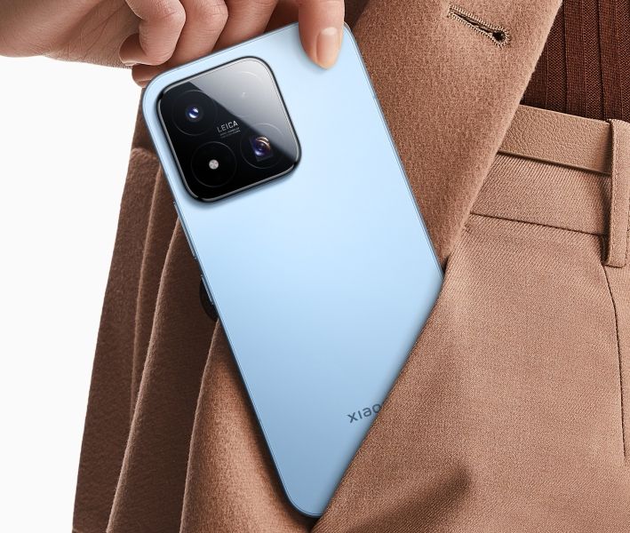 Xiaomi 17 Max smartphone in blue colurway being inserted in the pocket