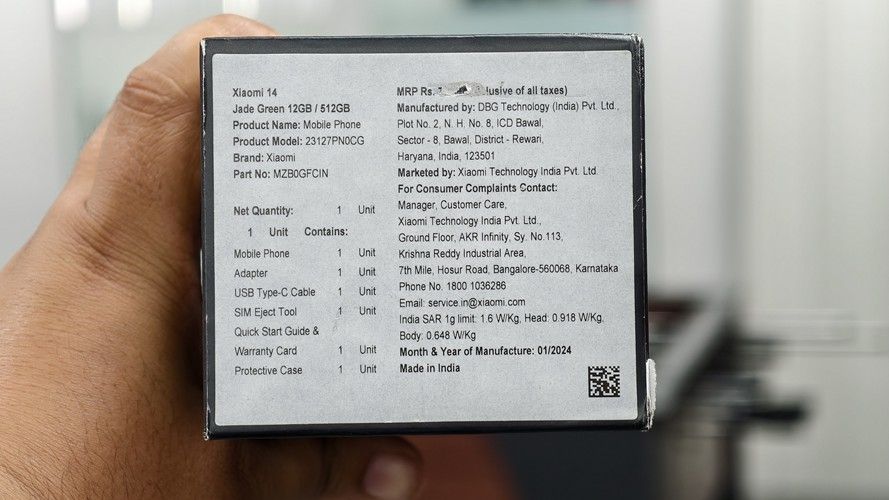 Xiaomi 14 retail packaging underneath with price and bar codes Xiaomi 14 retail packaging underneath with price and bar codes