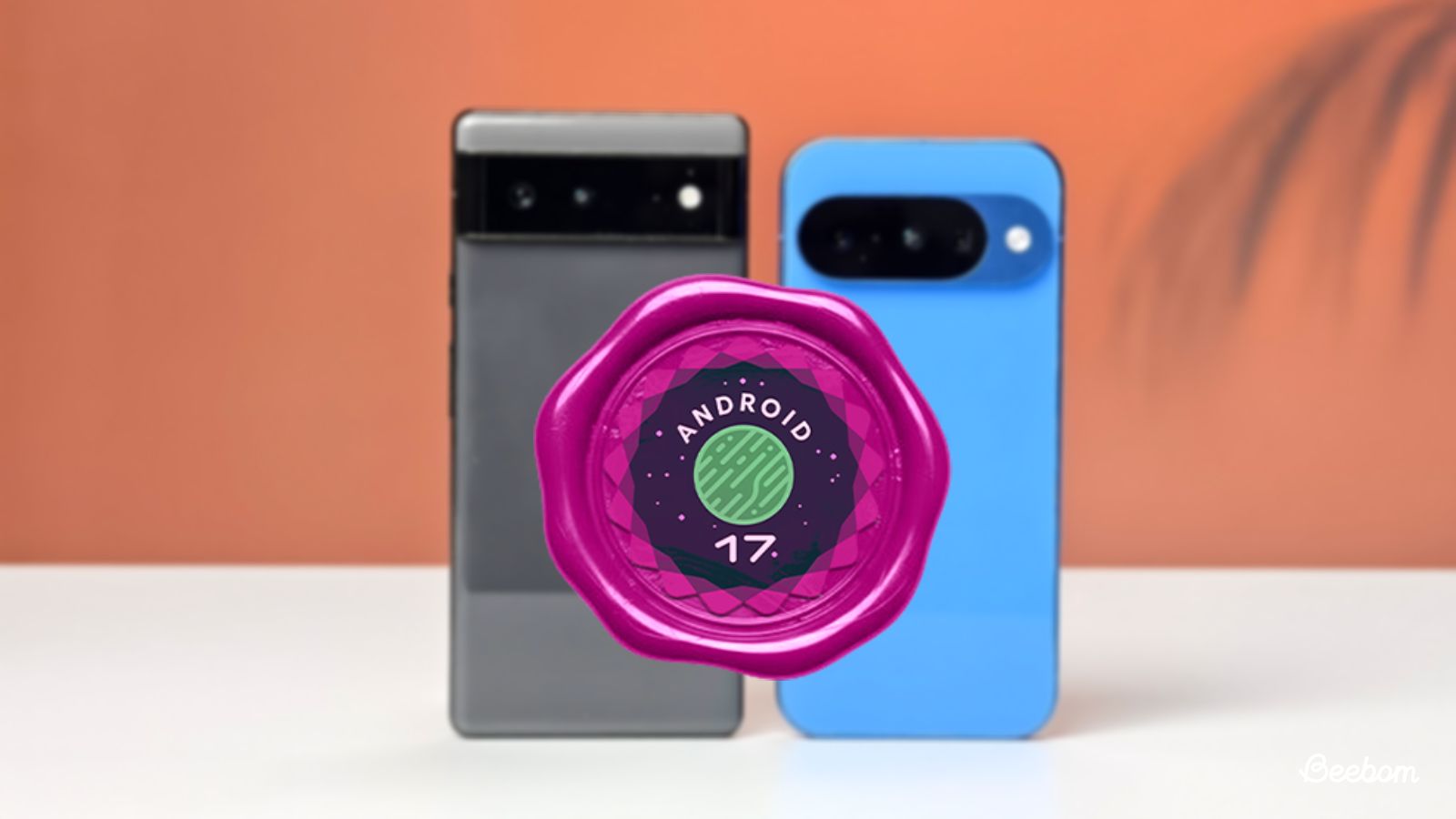 shot of two google pixel phones standing upright on a table with Android 17 logo