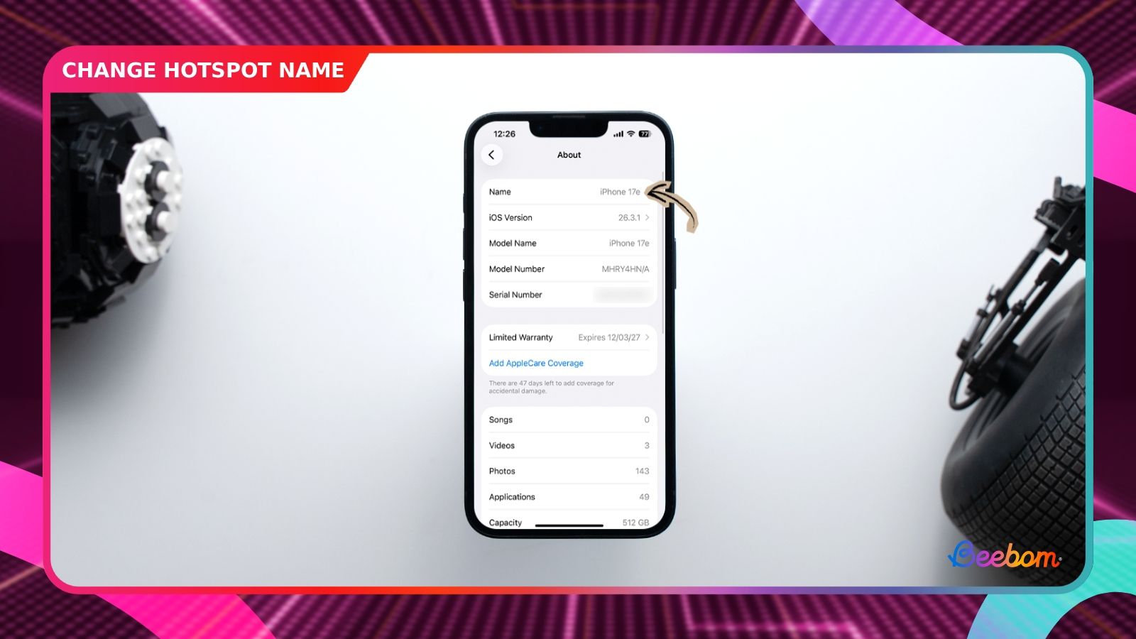 shot of an iphone placed on a desk showing the hotspot name inside settings app
