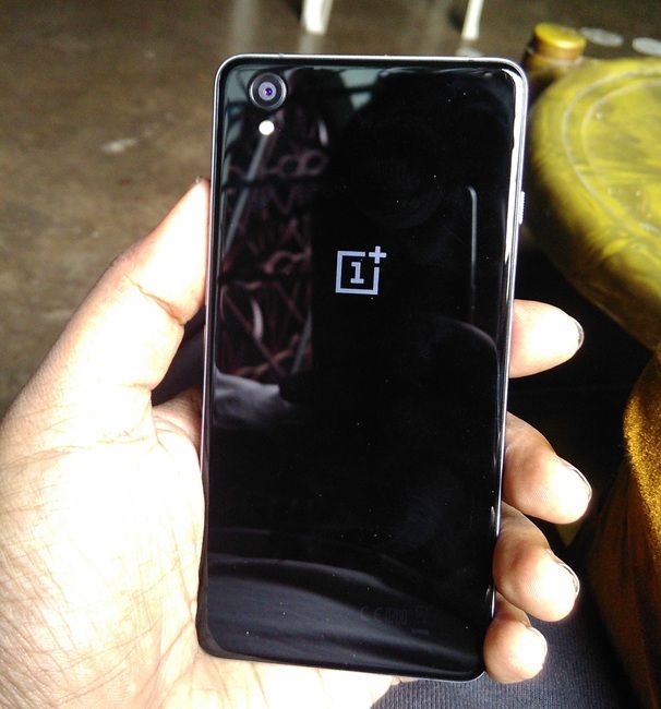 oneplus x in hand, back side visible
