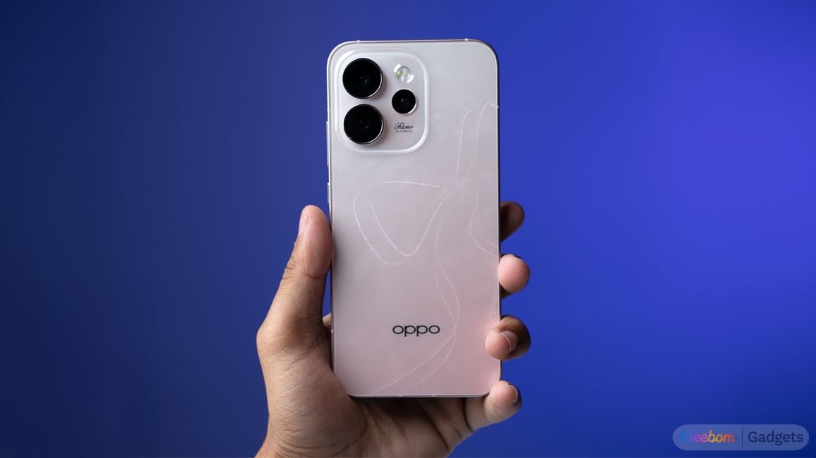 shot of a hand holding Oppo reno 15 in front of a blue background