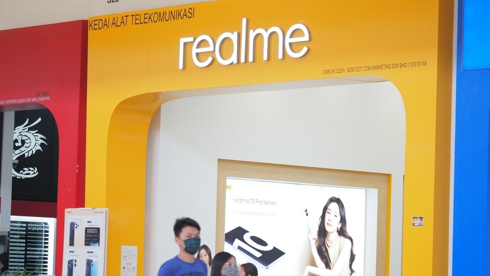 people moving around realme brand store