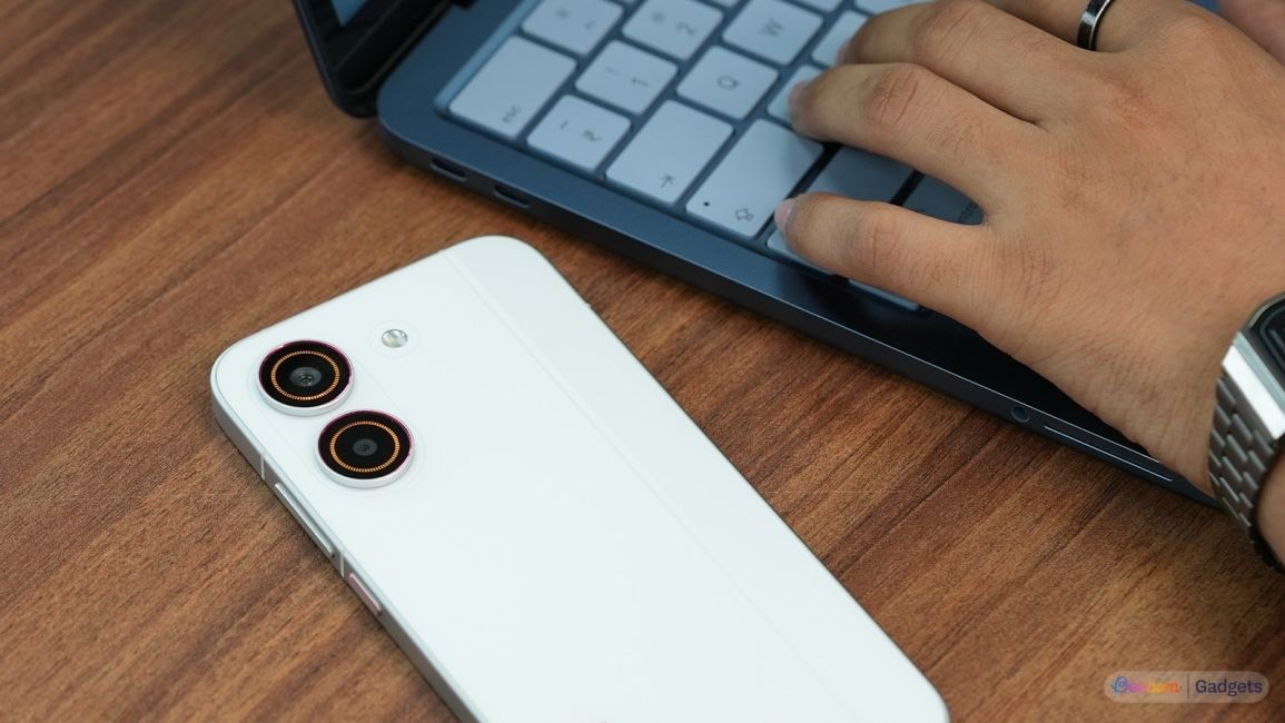 Redmi Turbo Shot laying on a wooden table 