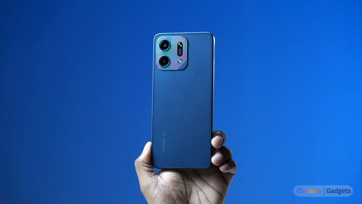 Lava Virat V1 5G held in hands against a blue background Lava Virat V1 5G held in hands against a blue background