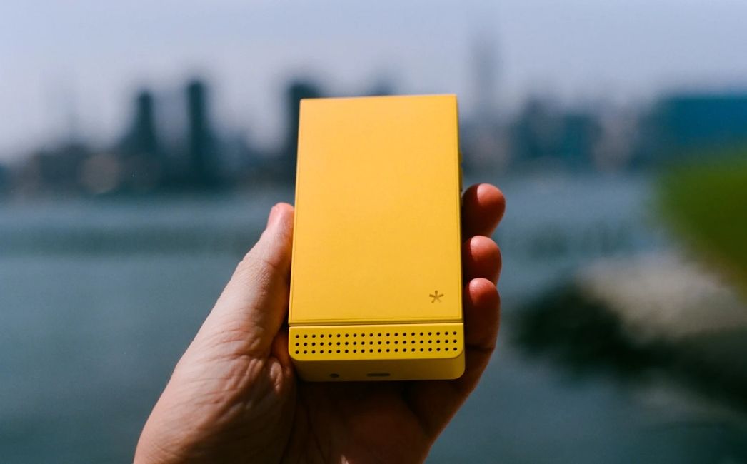 Light Flip smartphone closed in yellow colourway Light Flip smartphone closed in yellow colourway
