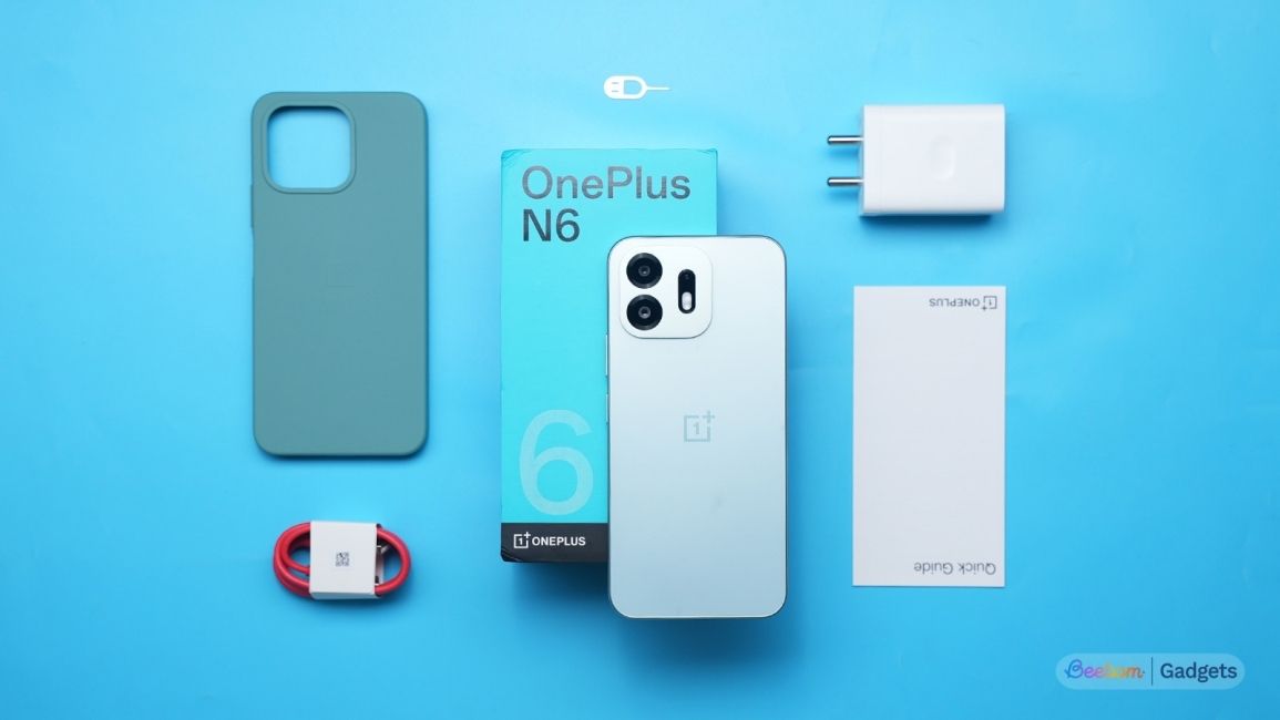 OnePlus N6 Box Contents laid out against a blue background OnePlus N6 Box Contents laid out against a blue background