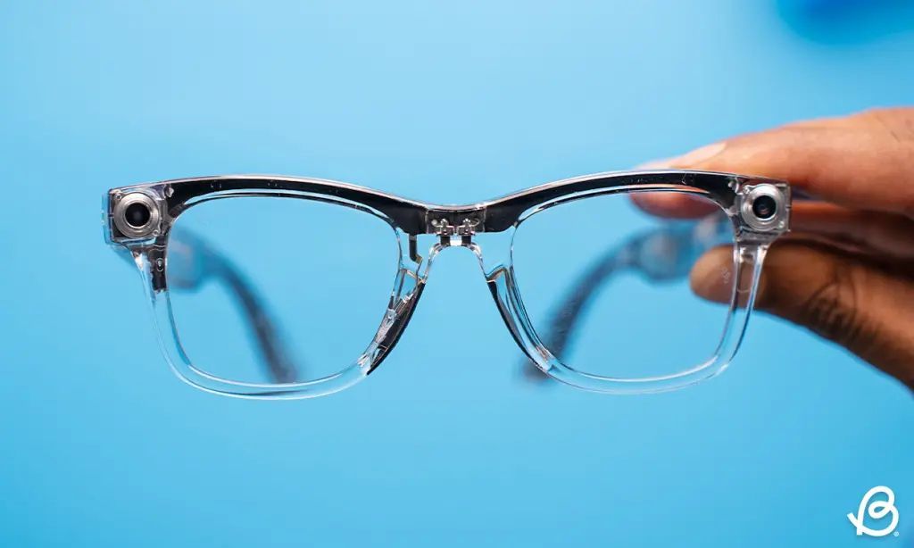 Ray-Ban Meta smart glasses transparent version held from the front 